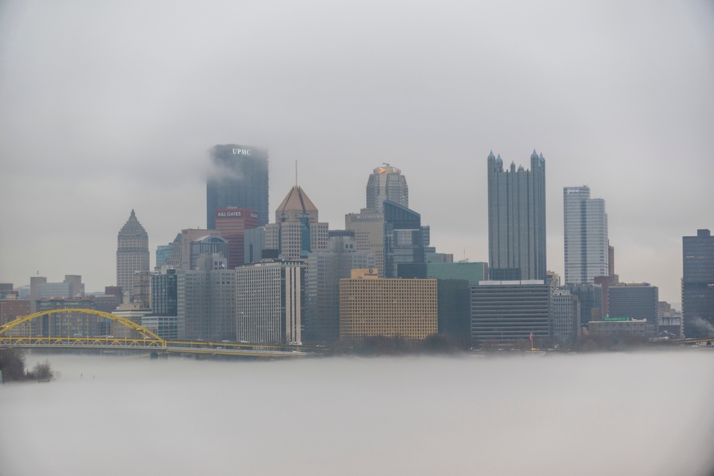 Towboats navigate through Pittsburgh District’s foggy landscape