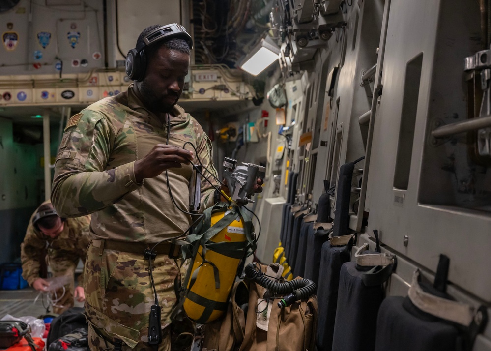 Airmen perform an aeromedical evacuation