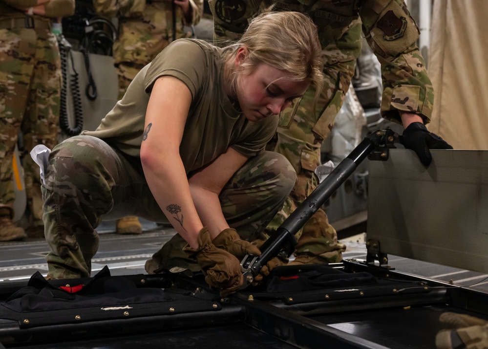 Airmen perform an aeromedical evacuation