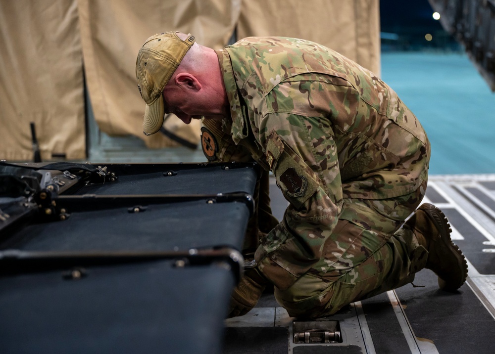 Airmen perform an aeromedical evacuation