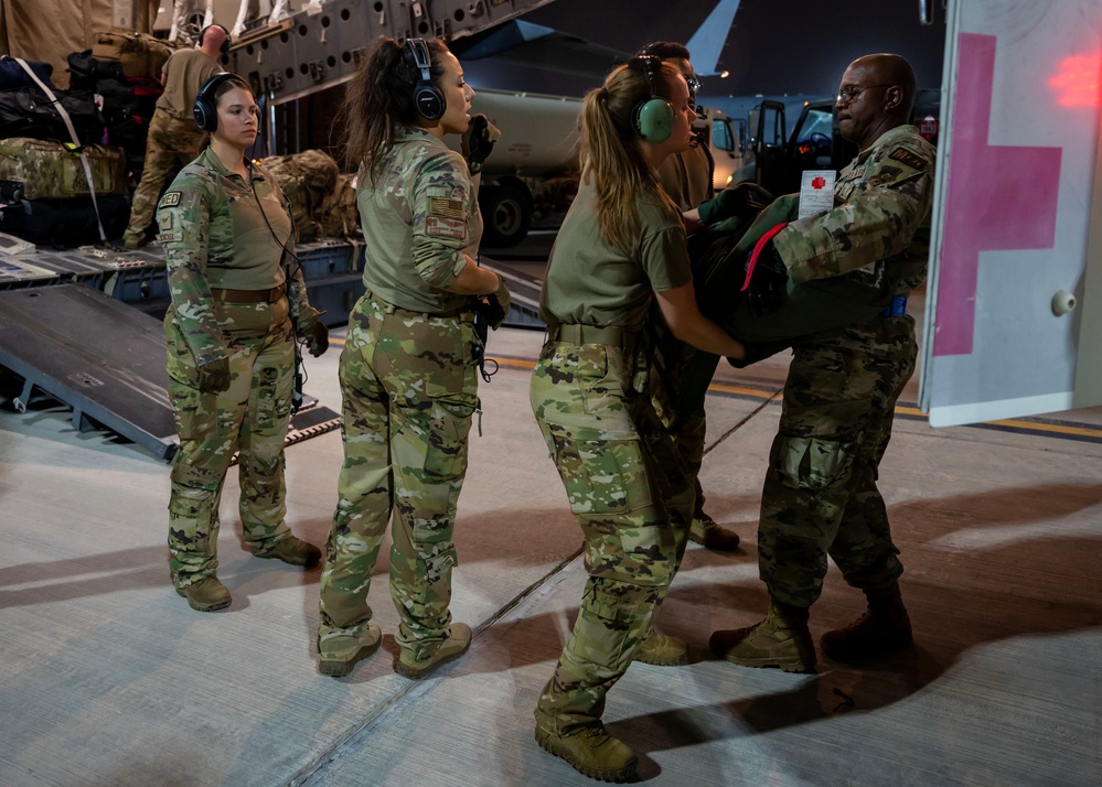 Airmen perform an aeromedical evacuation