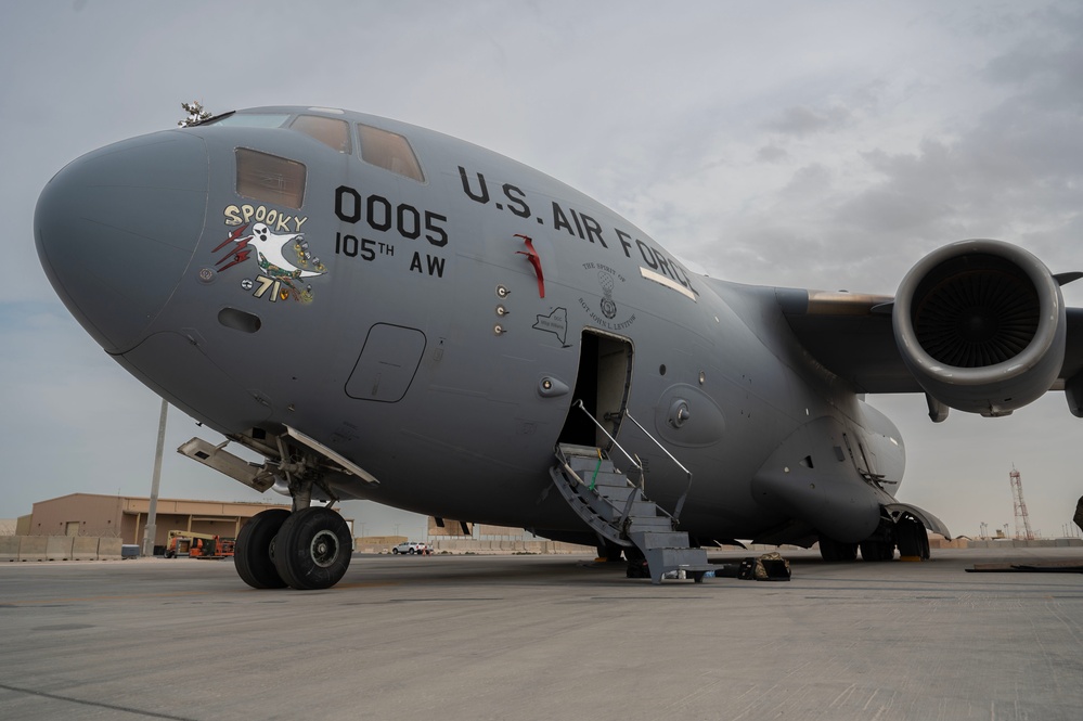 Maintenance Airmen repair engine on C-17 Globemaster III