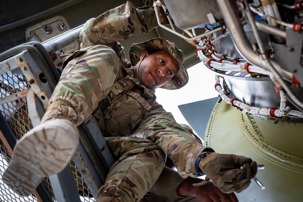 Maintenance Airmen repair engine on C-17 Globemaster III