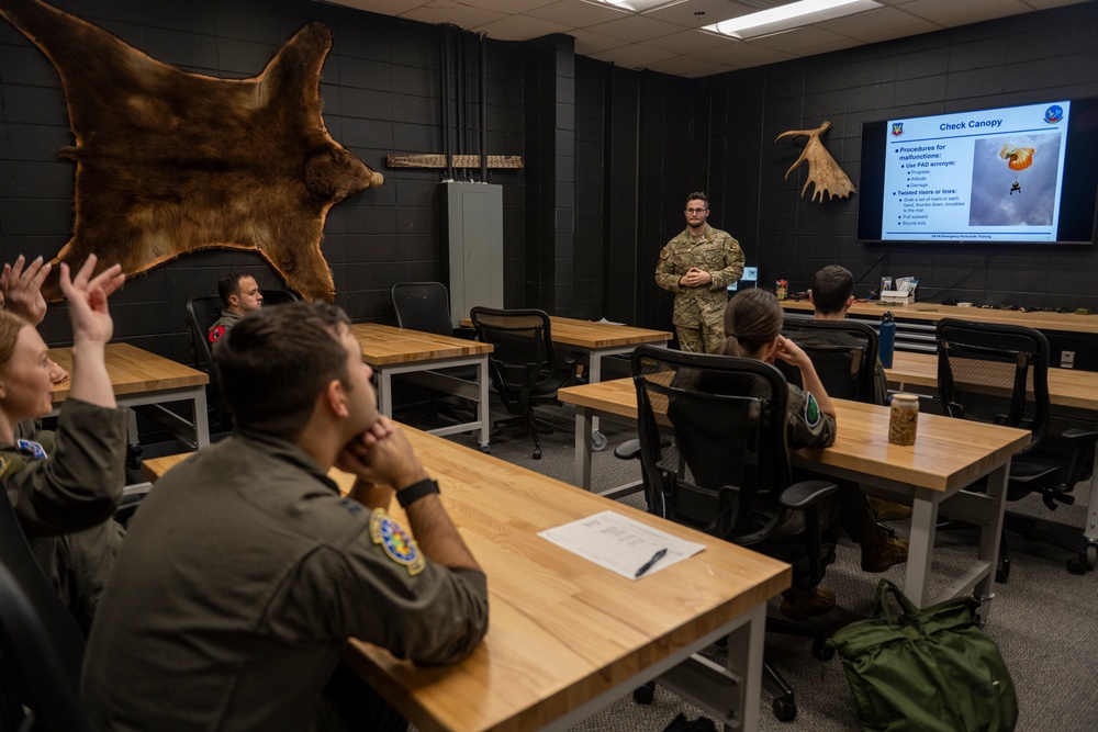 Pilots participate in emergency parachute training