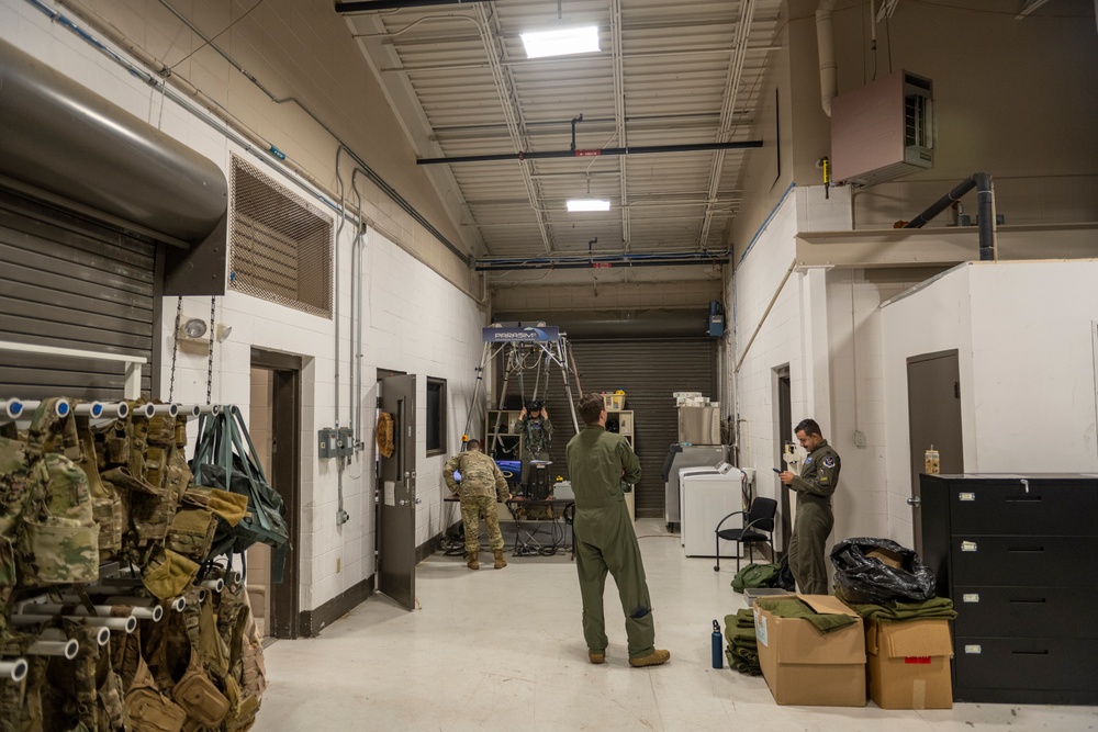 Pilots participate in emergency parachute training