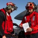 Sailors load ordnance