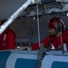 Sailors load ordnance