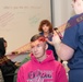 A simulated accident victim poses for photos of his moulage wounds.