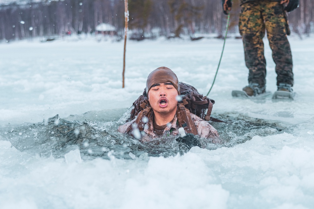 U.S. Marines and Sailors execute an ice-breaker drill before Exercise Nordic Response 24