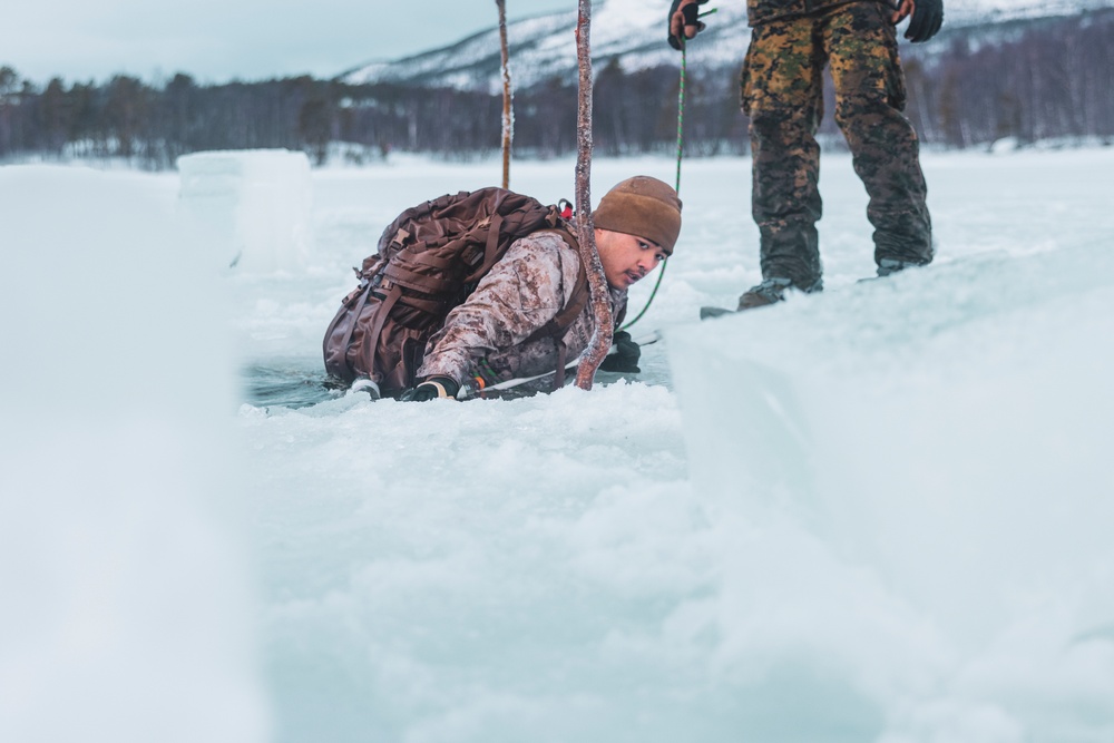 U.S. Marines and Sailors execute an ice-breaker drill before Exercise Nordic Response 24