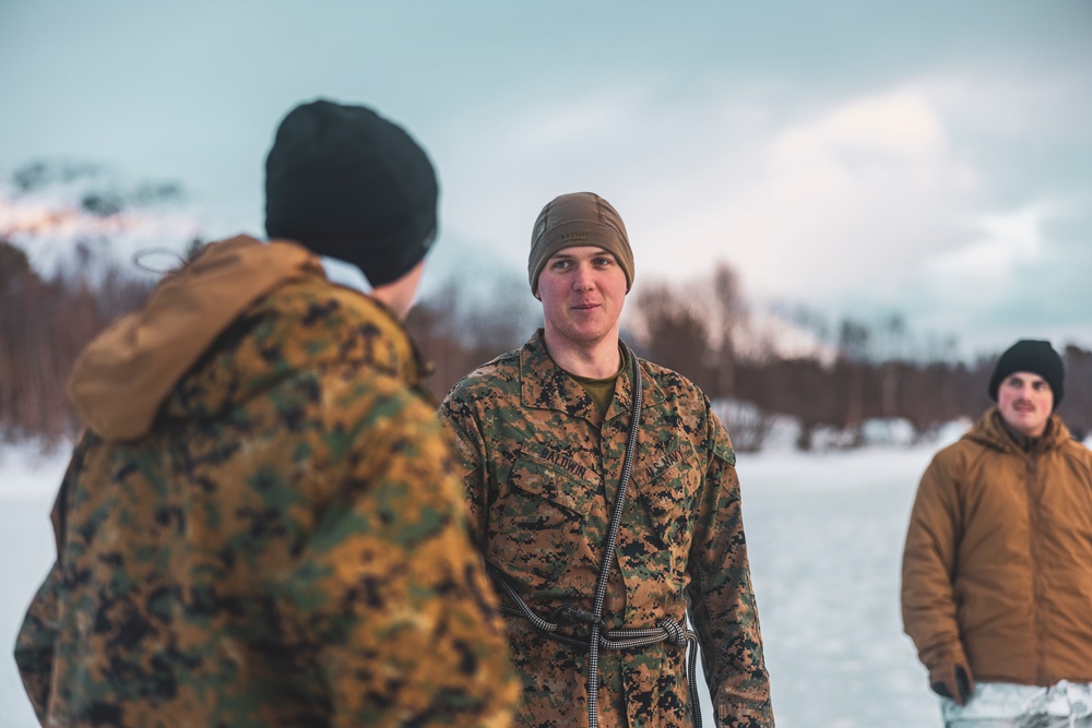 U.S. Marines and Sailors execute an ice-breaker drill before Exercise Nordic Response 24