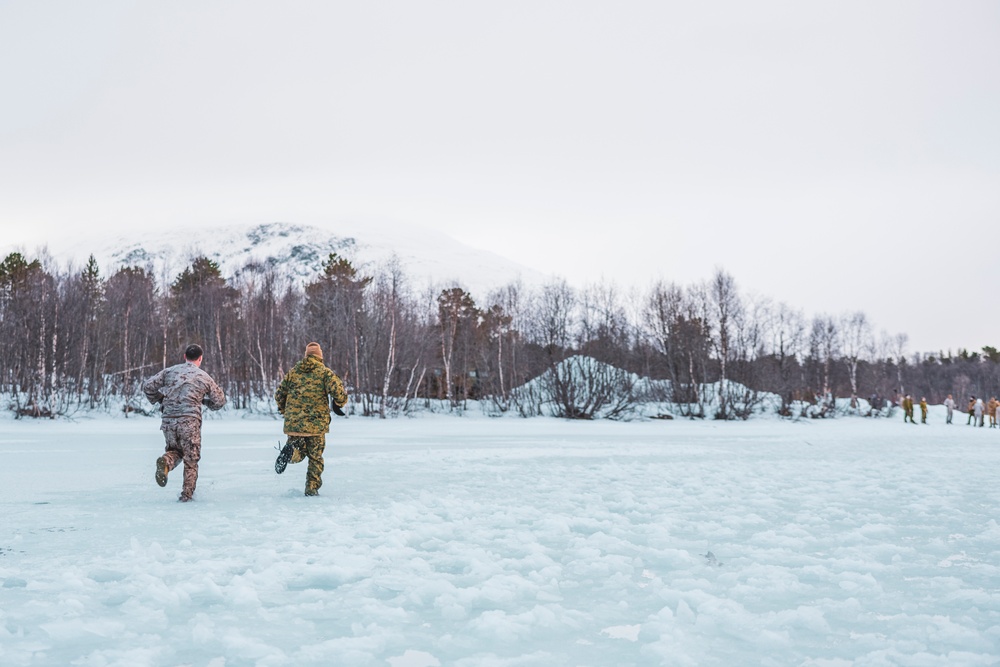 U.S. Marines and Sailors execute an ice-breaker drill before Exercise Nordic Response 24