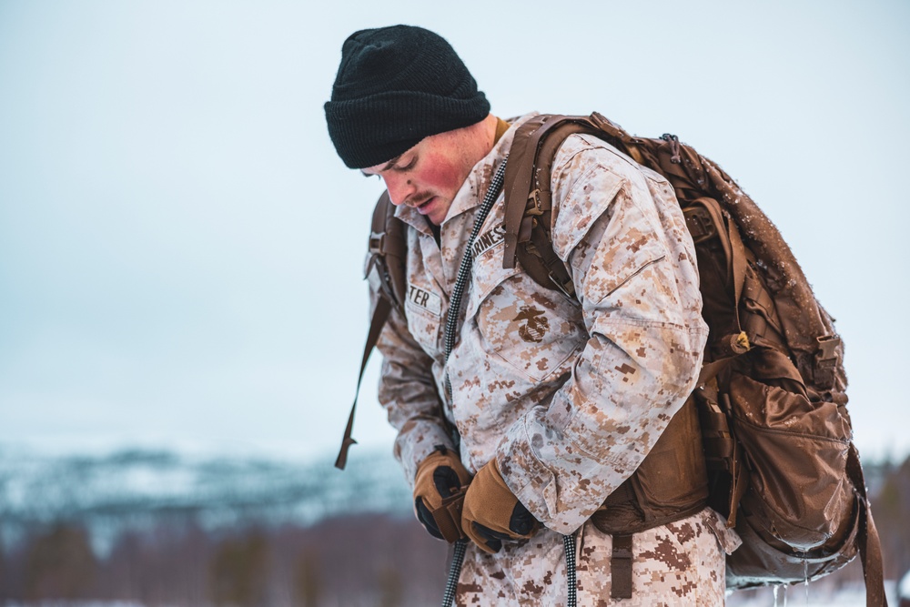 U.S. Marines and Sailors execute an ice-breaker drill before Exercise Nordic Response 24