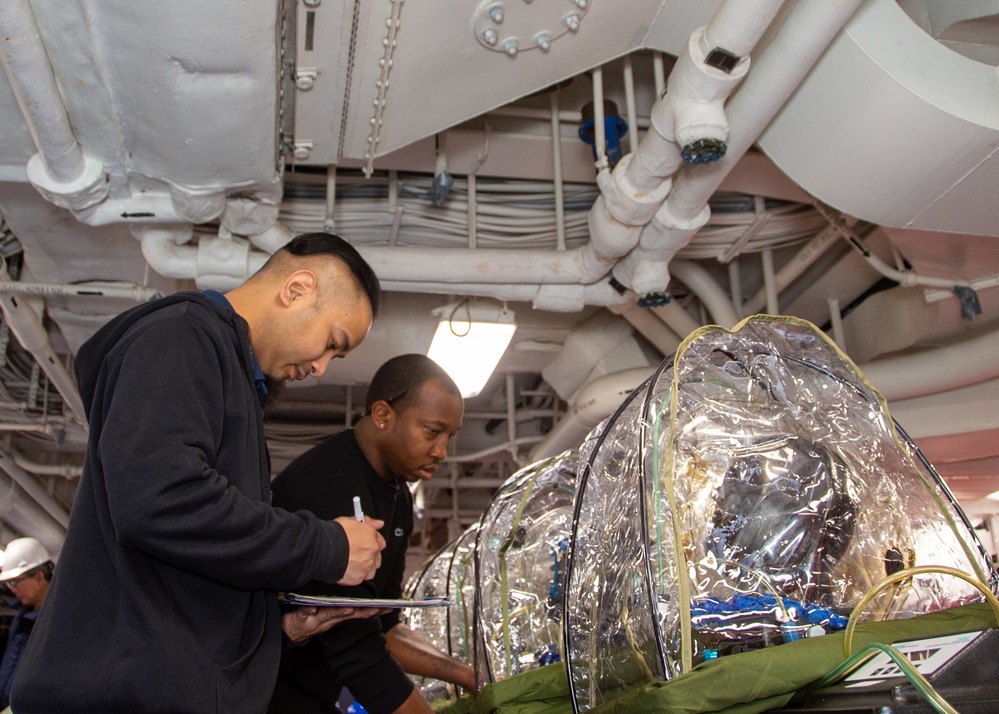 USS Ronald Reagan (CVN 76) conducts Chemical, Biological and Radiological mask and suit fitting