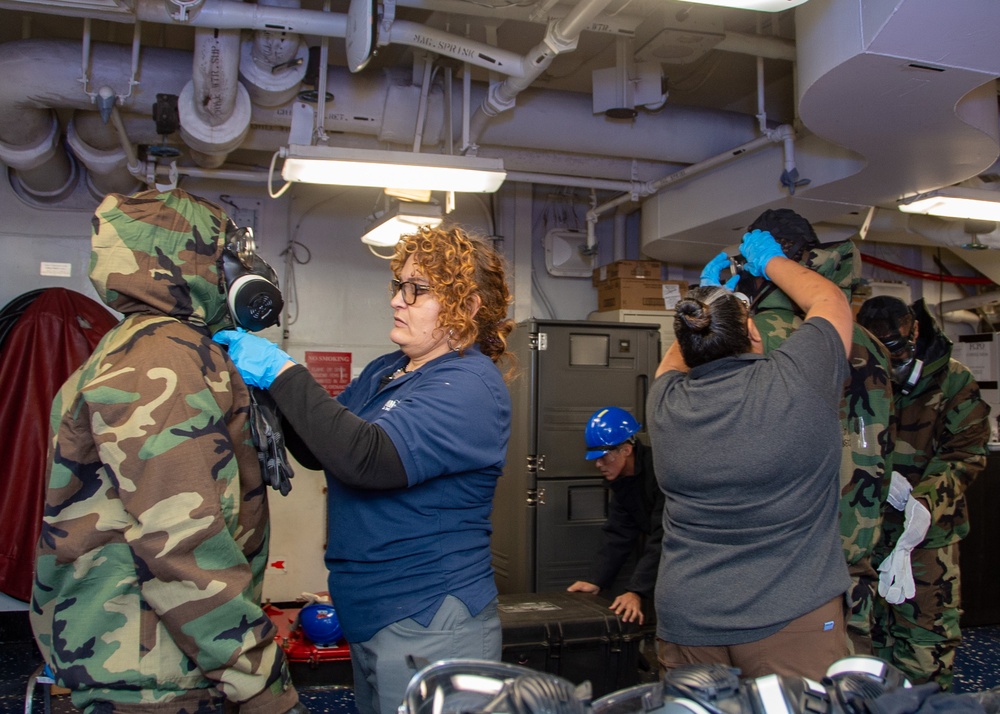 USS Ronald Reagan (CVN 76) conducts Chemical, Biological and Radiological mask and suit fitting