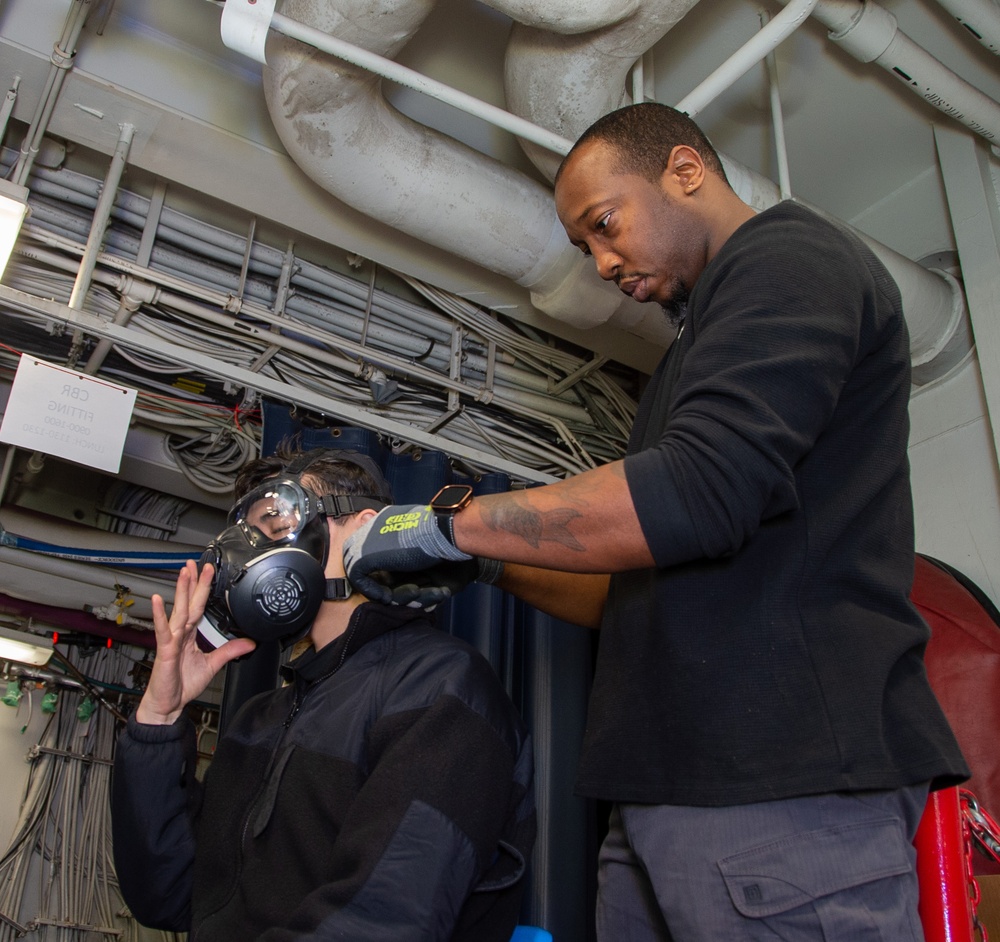 USS Ronald Reagan (CVN 76) conducts Chemical, Biological and Radiological mask and suit fitting