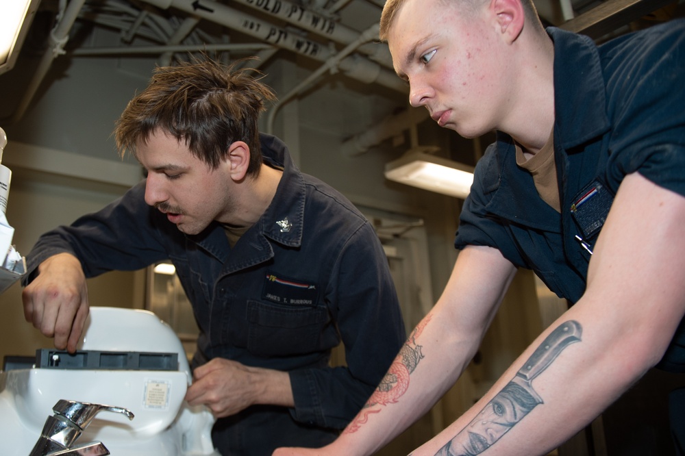 USS Ronald Reagan (CVN 76) Sailors renovate a bathroom