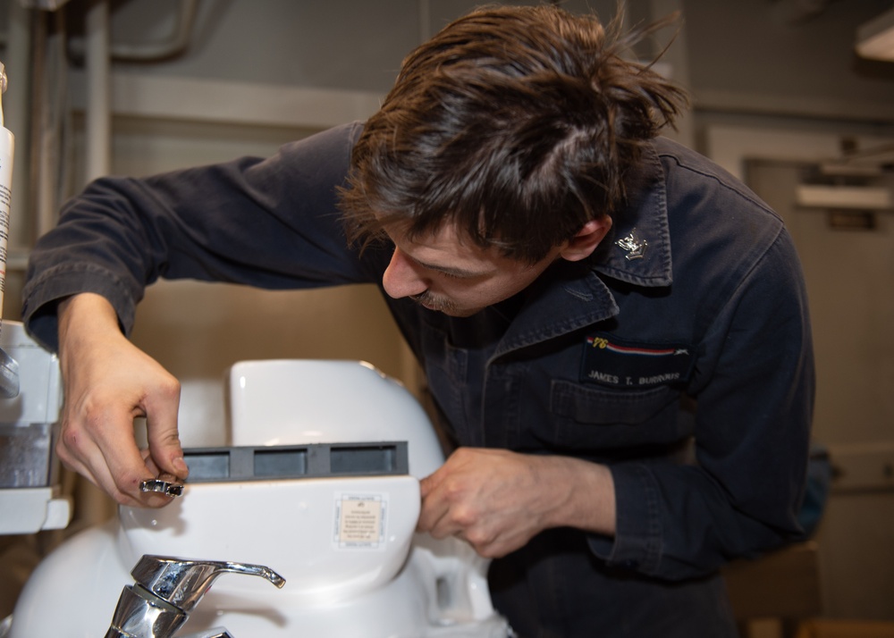 USS Ronald Reagan (CVN 76) Sailors renovate a bathroom