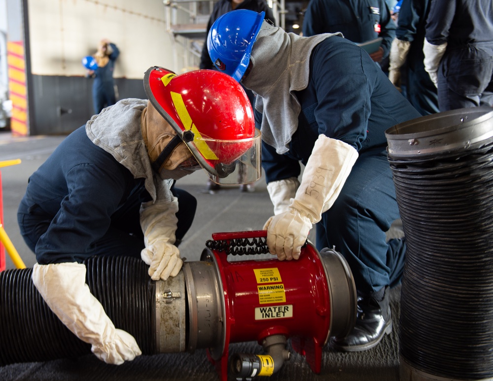 USS Ronald Reagan (CVN 76) Sailors train during general quarters drill