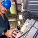 USS Ronald Reagan (CVN 76) Sailors calibrate a direct current ammeter
