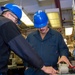 USS Ronald Reagan (CVN 76) Sailors calibrate a direct current ammeter