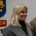 Maj. Gen. Todd Wasmund presents Patricia Tasad with a SETAF-AF coin