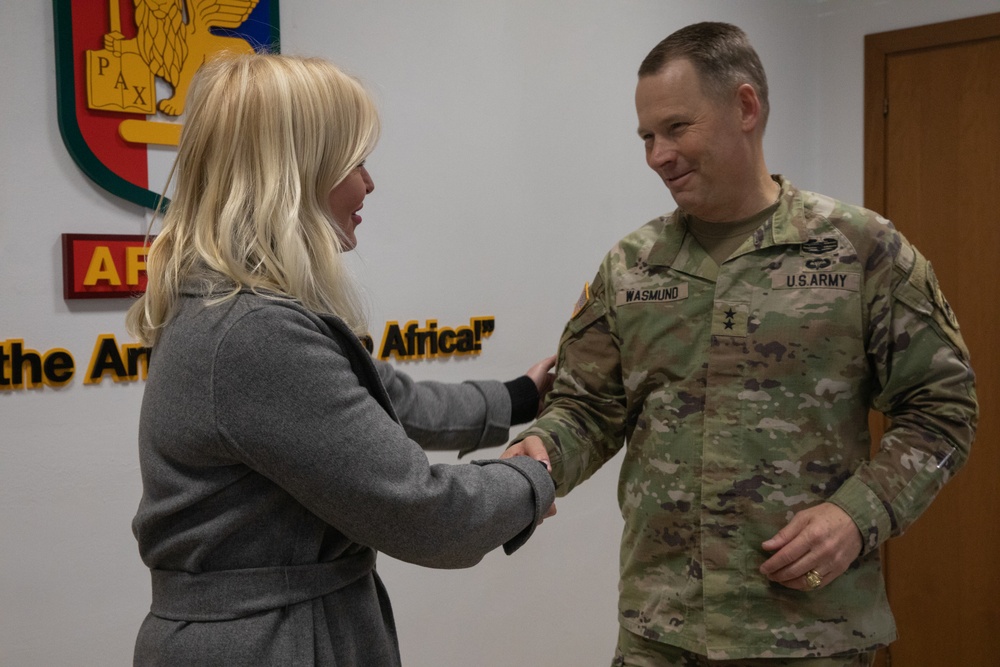 Commanding General Todd Wasmund presents Patricia Tasad with a SETAF-AF coin