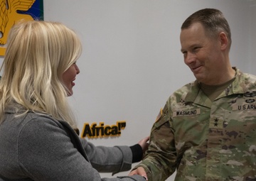 Commanding General Todd Wasmund presents Patricia Tasad with a SETAF-AF coin