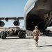 Marines with 3rd LAR load tactical vehicles onto Air Force C-17 Globemaster III cargo aircraft