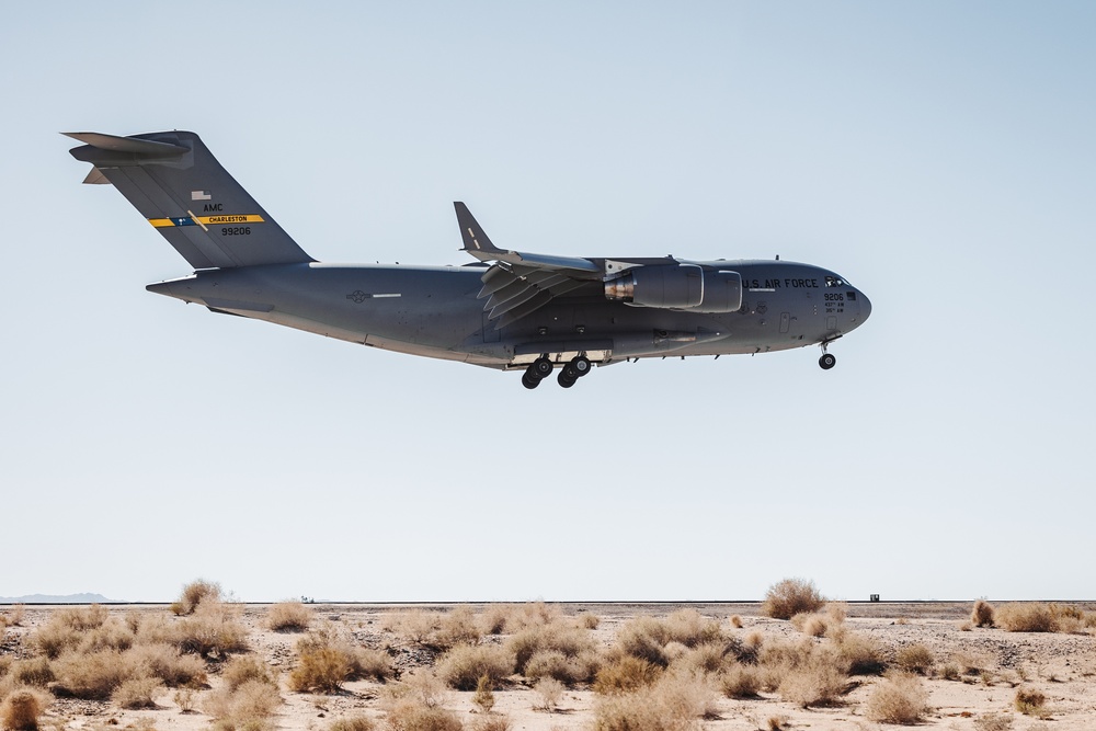 Marines with 3rd LAR load tactical vehicles onto Air Force C-17 Globemaster III cargo aircraft