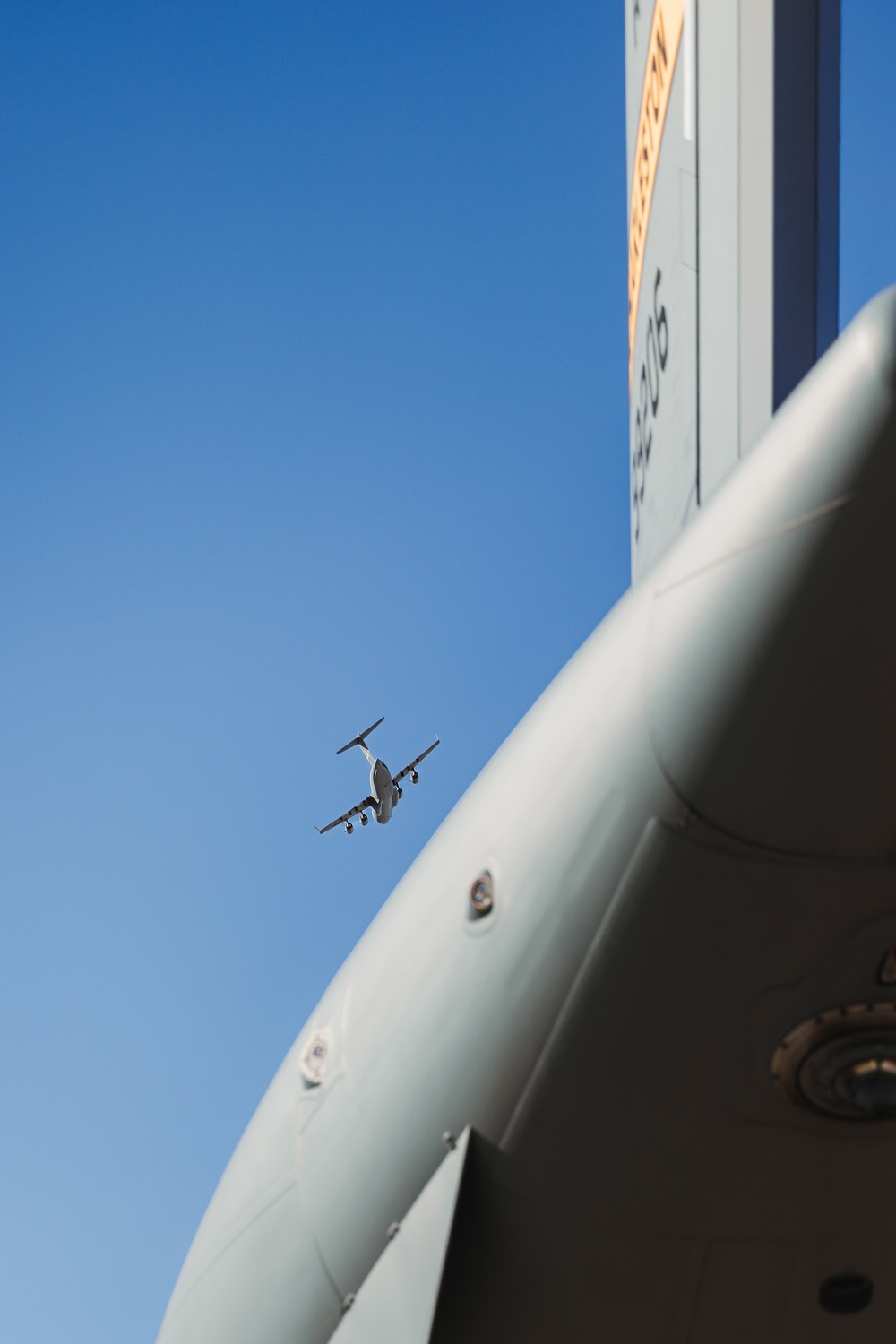 Marines with 3rd LAR load tactical vehicles onto Air Force C-17 Globemaster III cargo aircraft