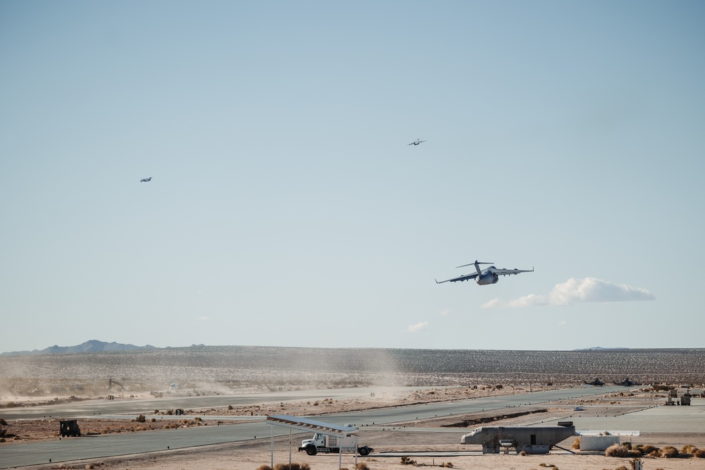 Marines with 3rd LAR load tactical vehicles onto Air Force C-17 Globemaster III cargo aircraft