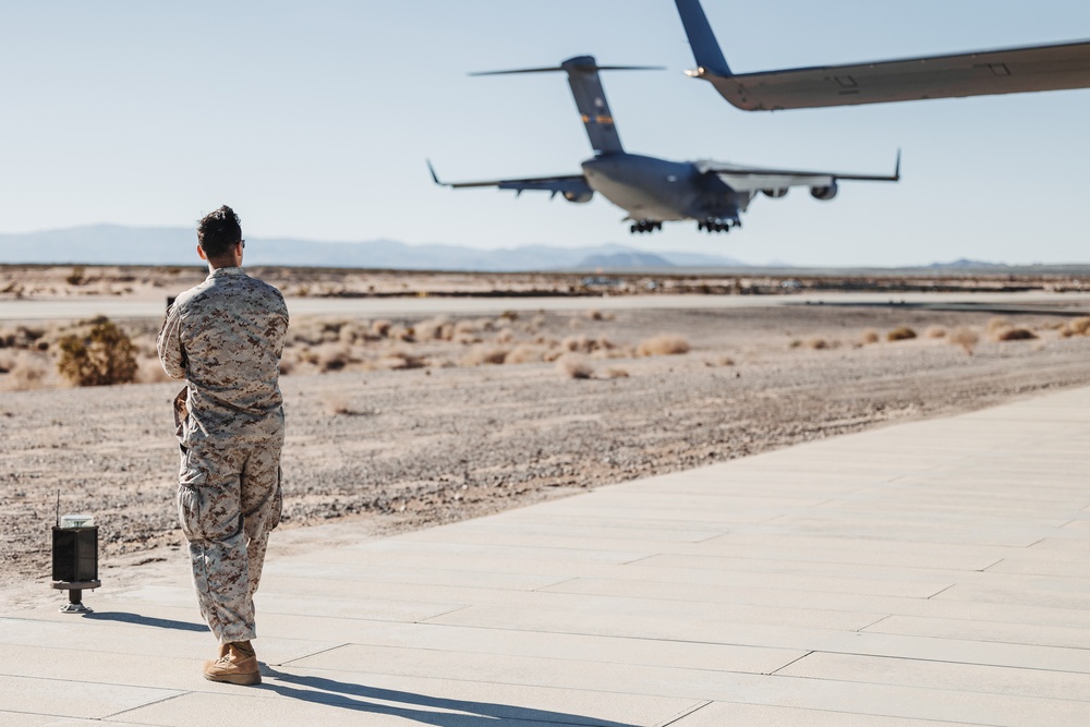 Marines with 3rd LAR load tactical vehicles onto Air Force C-17 Globemaster III cargo aircraft