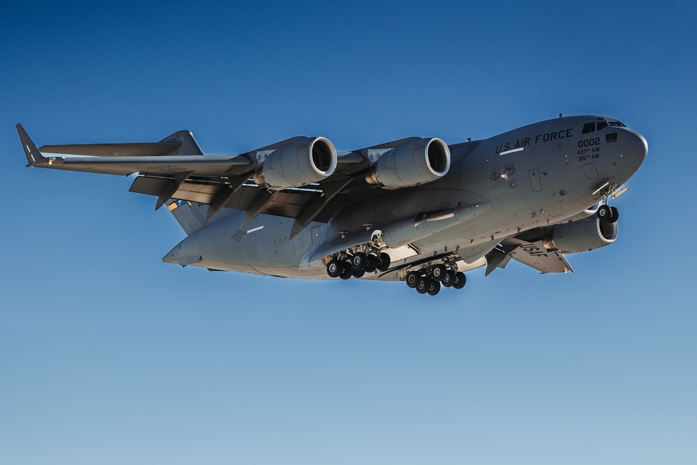 Marines with 3rd LAR load tactical vehicles onto Air Force C-17 Globemaster III cargo aircraft