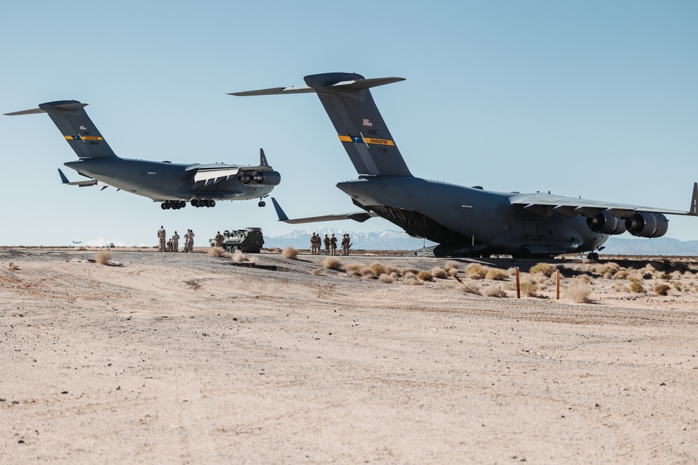 Marines with 3rd LAR load tactical vehicles onto Air Force C-17 Globemaster III cargo aircraft