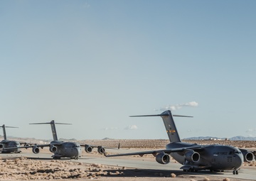 Marines with 3rd LAR load tactical vehicles onto Air Force C-17 Globemaster III cargo aircraft