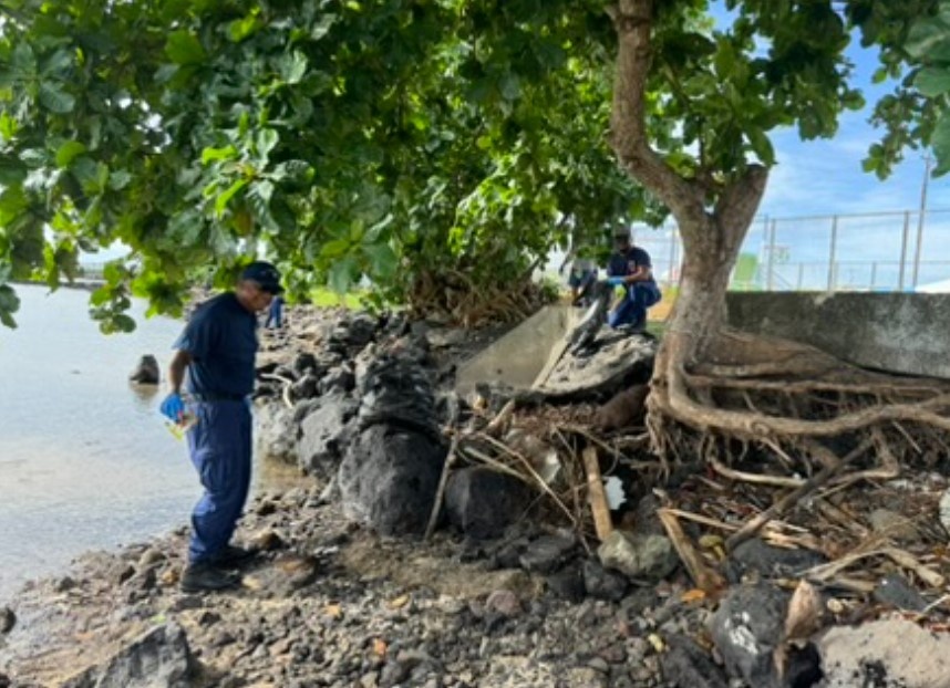 U.S. Coast Guard Cutter Harriet Lane cleans beach in American Samoa