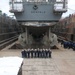 The chiefs mess of the USS Benfold (DDG 65) pose for a group photo in a dry dock onboard Commander, Fleet Activities Yokosuka