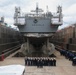 The wardroom of the USS Benfold (DDG 65) pose for a group photo in a dry dock onboard Commander, Fleet Activities Yokosuka