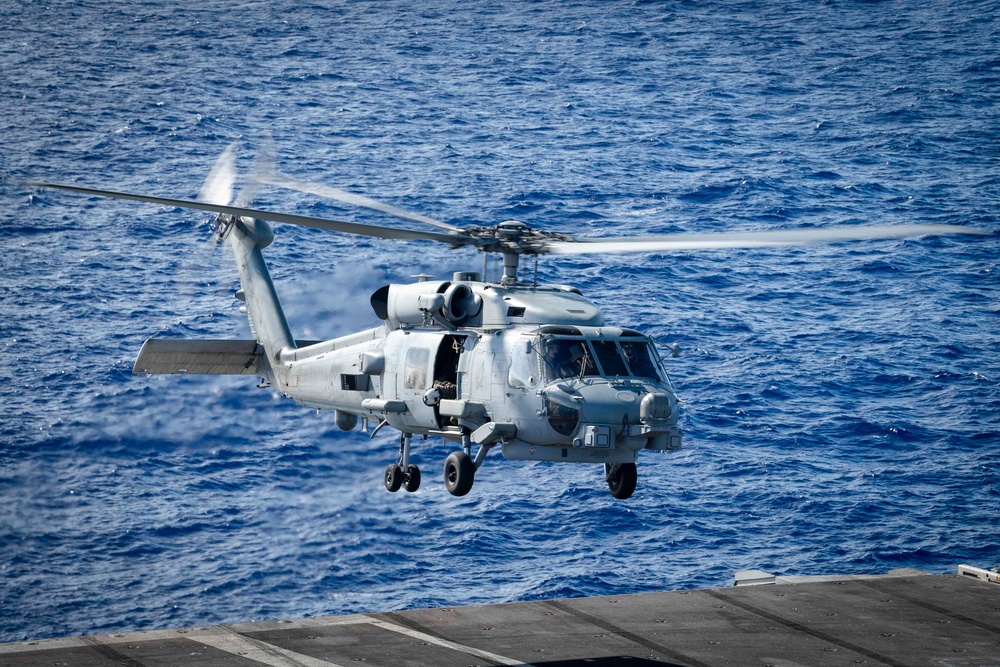 An MH-60R Sea Hawktakes off from the flight deck aboard Nimitz-class aircraft carrier USS Carl Vinson (CVN 70)