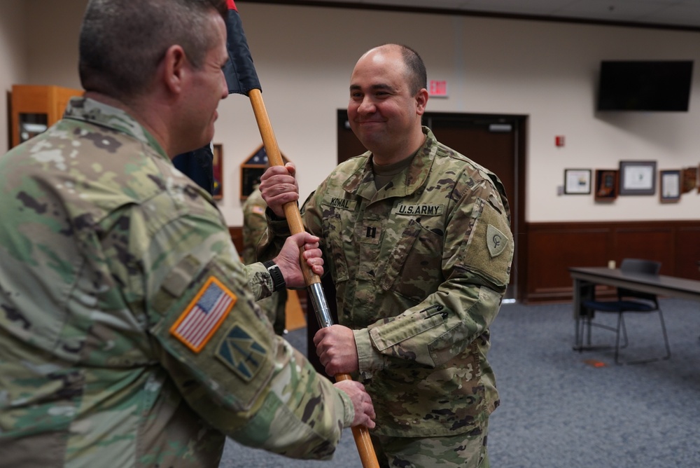 38th Infantry Division Headquarters Support Company commander receives company guidon during change of command ceremony