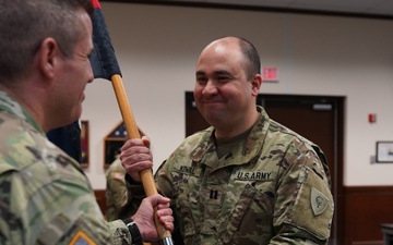 38th Infantry Division Headquarters Support Company commander receives company guidon during change of command ceremony
