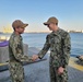Gunner’s Mate 3rd Class Adriano Perez assigned to Maritime Expeditionary Security Squadron (MSRON) 2 Alpha company reenlists on the pier during his United Arab Emirates deployment.