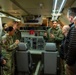 Naval Air Crewman (Mechanical) 2nd Class Gabrial Williams leads a guided tour of an E-6B Mercury as part of the USSTRATCOM Component Commanders Conference, Feb. 5, 2024.