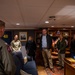 Members of the USSTRATCOM Component Commanders Conference speak with Capt. Richard Burgess, commanding officer, USS Gerald R. Ford (CVN 78), Feb. 5, 2024.