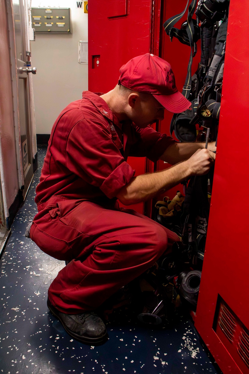 USS Carl Vinson (CVN 70) Sailor Inspects Gear