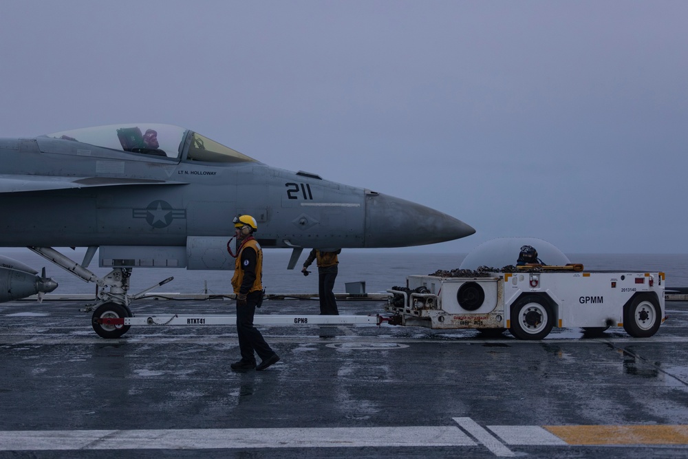 Abraham Lincoln Sailors taxi aircraft