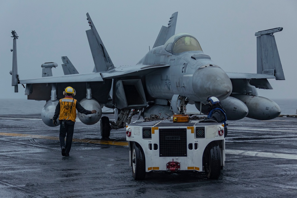 Abraham Lincoln Sailors taxi aircraft