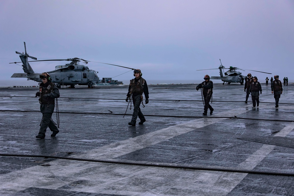 Abraham Lincoln Sailors taxi aircraft