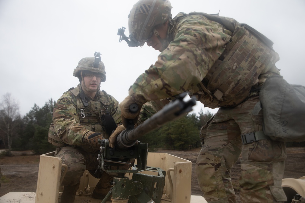 Task Force Provider Soldiers execute a convoy live fire exercise